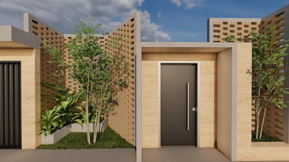 Detalhe do acesso social: porta emoldurada por porcelanato amadeirado e jardim lateral.